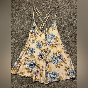 Flower tank top with open cris cross back.